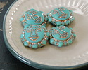 Czech Glass Matte Turquoise w/ Platinum Sun Face 18mm