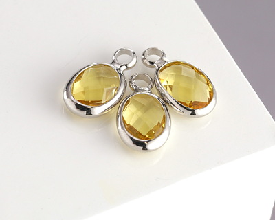 Yellow Crystal Oval Drop in Silver Finish Bezel 6x8mm